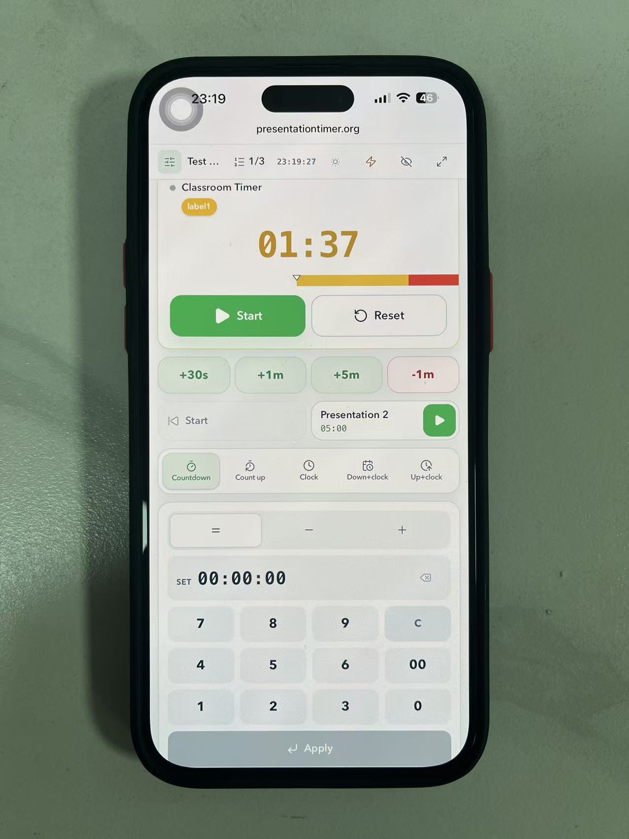 Teacher's phone running the Operator View touch console that controls the giant classroom timer on the board